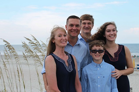 A family photo of the Terry family. Chrissy is the woman on the left, along with her husband and 3 kids.